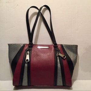 Super cute edgy purse. Gianni Binni